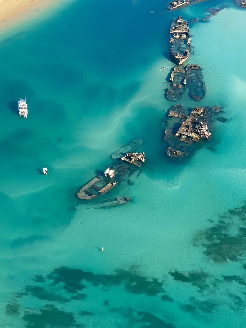 Aerial view of shipwrecks in turquoise water at Moreton Island