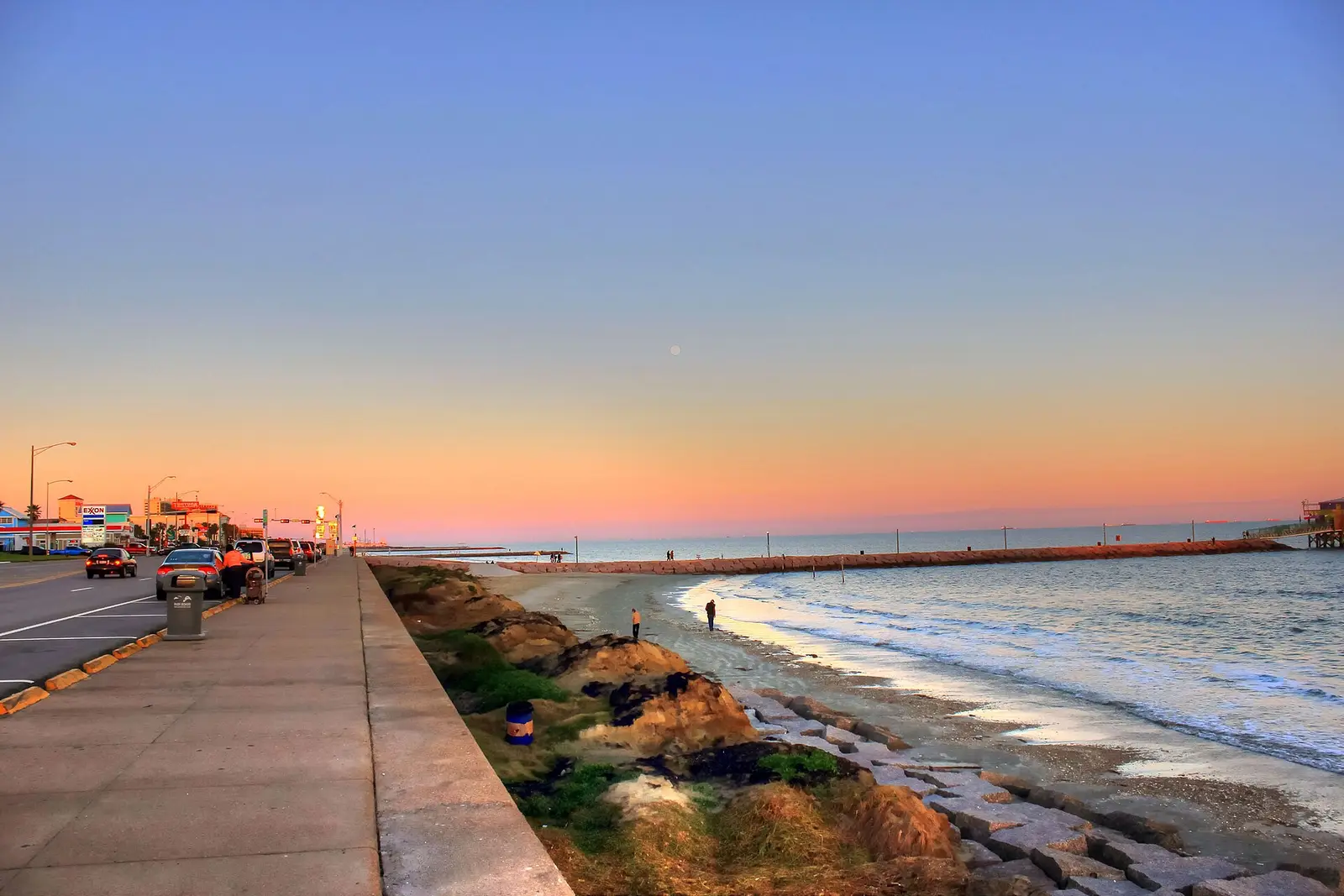 Seawall Boulevard and the Gulf shoreline at Galveston at sunset