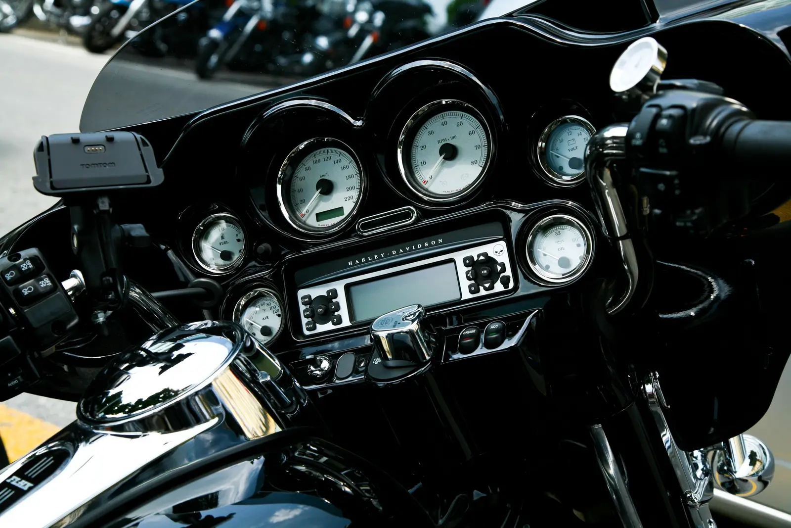 A phone mounted on motorcycle handlebars