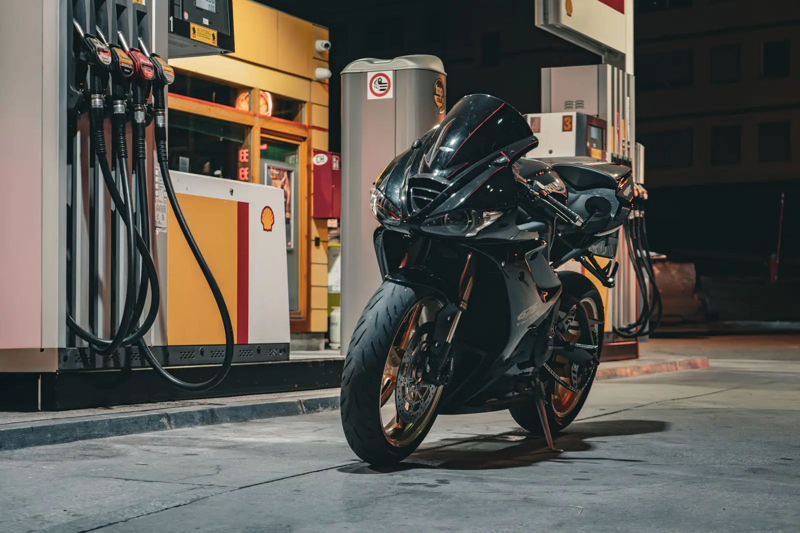 A motorcycle at a fuel stop