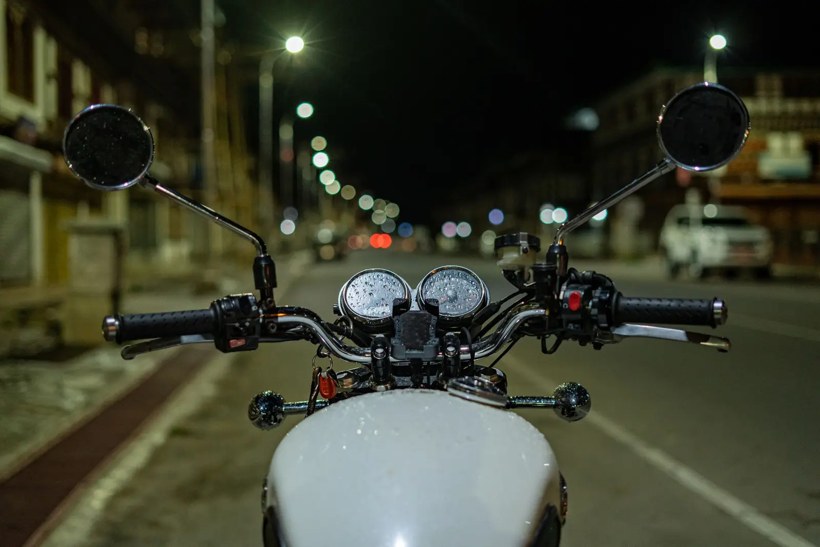 A phone mounted on motorcycle handlebars