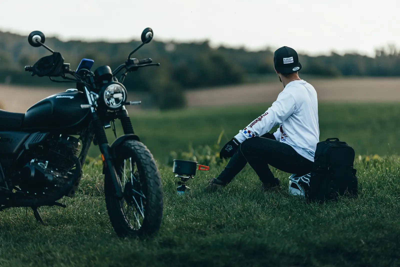 A motorcycle beside a tent at a campsite