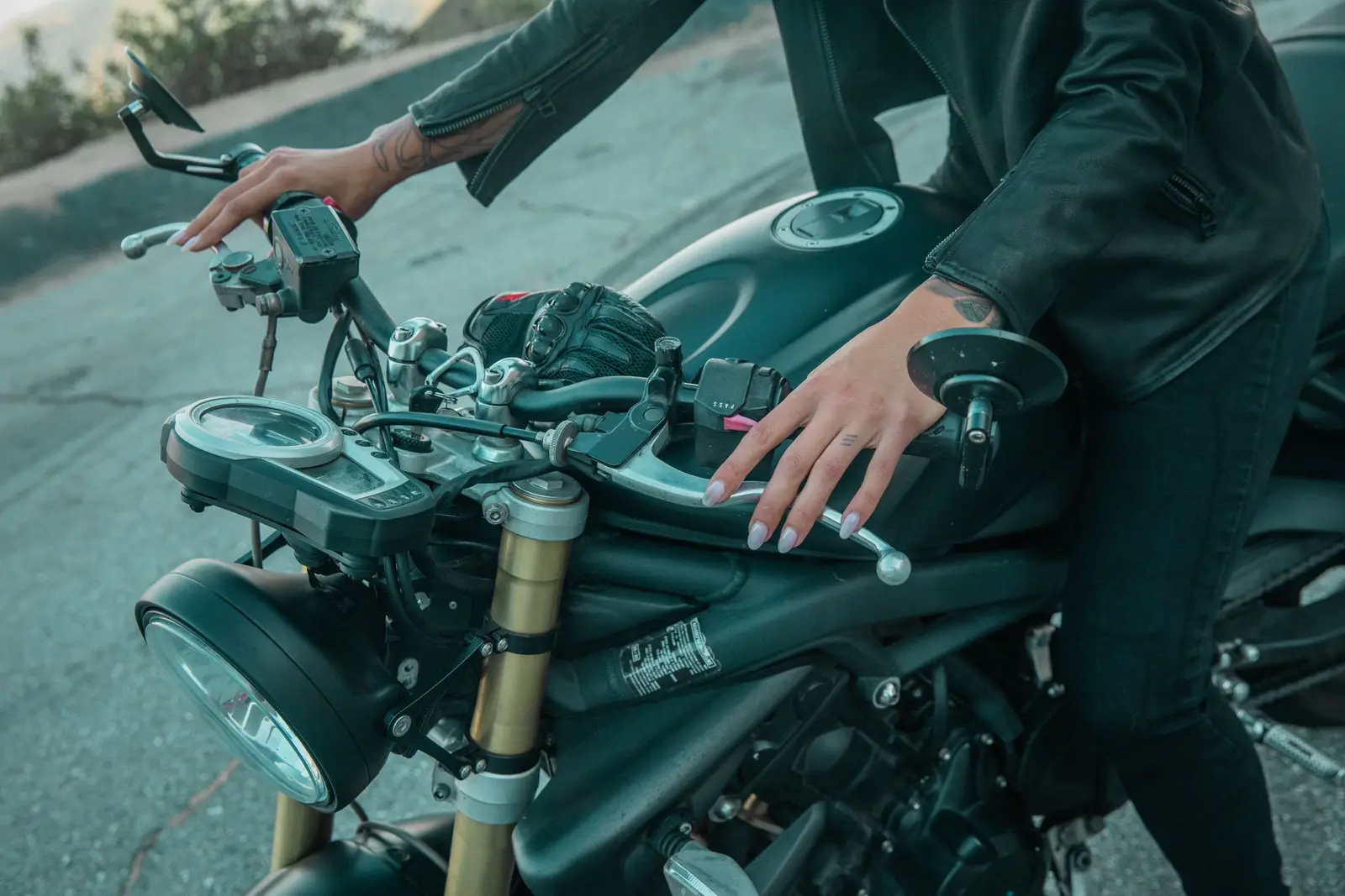 A phone mounted on motorcycle handlebars