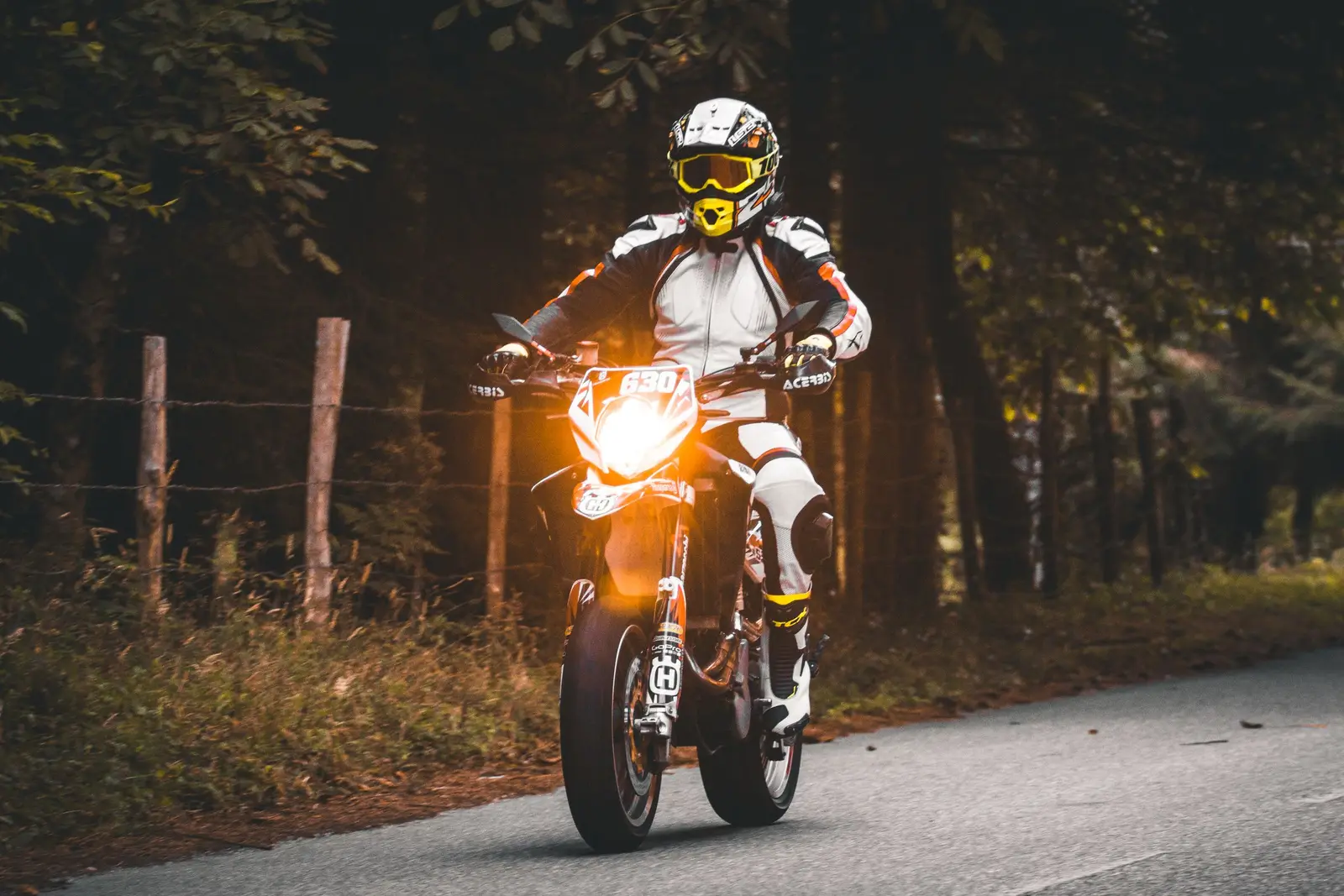 A motorcyclist riding along an open road